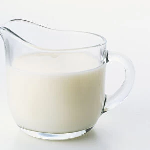 Clear glass jug of low-fat milk