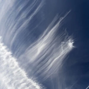 Cloudscape with alto cirrus and contrails over the Thames at Oxford, England