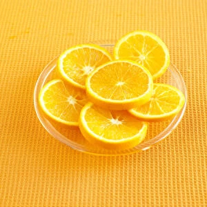 Orange slices on glass plate, close up