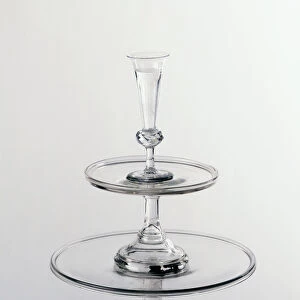 A tiered cake stand made of glass