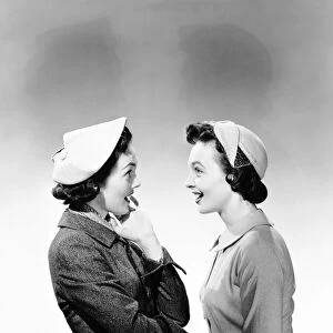 Two women sharing the latest gossip