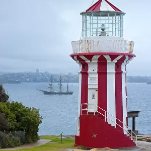 Lighthouse in the harbour with the three-master Bounty, Sydney