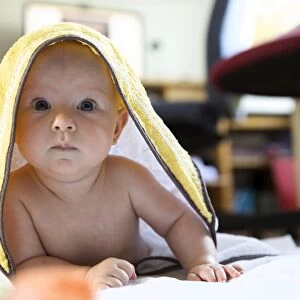 Baby, 4-5 months old, under a towel, Germany