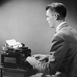 Businessman inside office typing