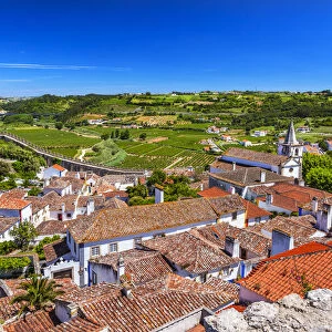 Medieval town with fortified walls and Santa Maria church, Obidos, Portugal