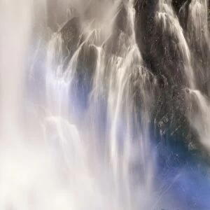 Waterfall with faint rainbow, blue spectrum, Bridal Veil Falls, Kanai Penninsula