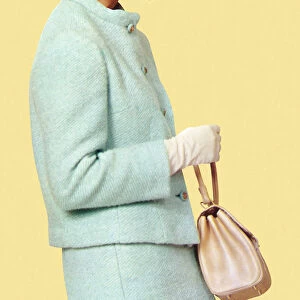 Woman in Blue Suit Holding Purse