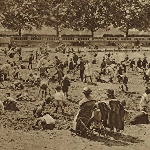 The beach without a sea: castles in the sand in Bishops Park by the river at Fulham (b / w photo)