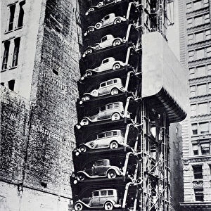 Cars in an elevator parking lot, New York City, New York, USA, 1920s (b / w photo)