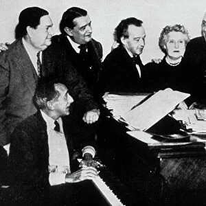 The "Groupe des Six" with Jean Cocteau (piano) : l-r : Darius Milhaud, Georges Auric, Arthur Honegger, Germaine Tailleferre, Francis Poulenc and Louis Durey