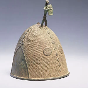 Helmet surmounted by a figure, Koma-Builsa, Ghana (bronze)