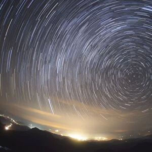 Stars circle around the north celestial pole above Nanchang city, China