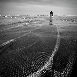 Fisherman in net