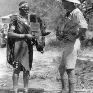 Errol Hinds making a deal in chickens, Wankie to Victoria Falls, Southern Rhodesia, 1925 (1927). Artist: Thomas A Glover