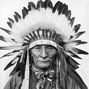 A Native American chief wearing his headdress