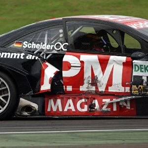 The heavily damaged car of Timo Scheider (GBR), OPC Team Phoenix, Opel Astra V8 Coupe finished 15th