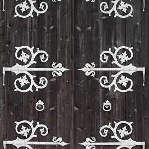 Large Metal Decorative Hinges On A Weathered Wooden Barn Door; Fussen, Germany