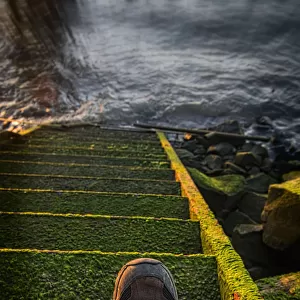 An Old Stairway On The Astoria Riverfront That Leads Into The Water; Astoria, Oregon, United States Of America