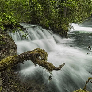 A River Flows Over A Small Waterfall In Nisga a Memorial Lava Bed Provincial Park; British Columbia, Canada