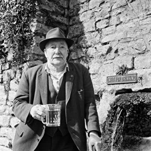 80-year-old Bob Smart drinking at the Batheaston horse trough. 26th March 1971