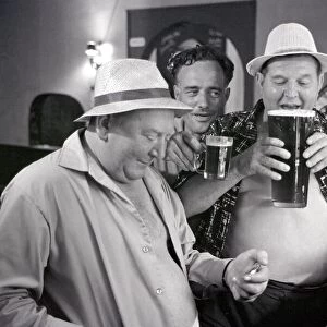 British tourists enjoying a litre of beer whilst on holiday in Spain June 1965