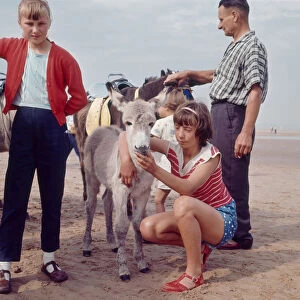 Children about to go for a donkey ride on the beach at Blackpool, 1963