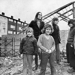 Children standing guard over The Big Lamp youth club which is now under construction in