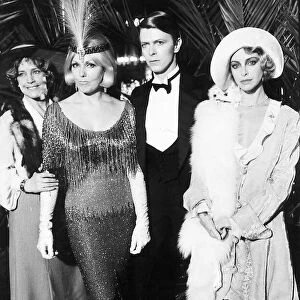 David Bowie rock star, singer and actor surrounded by the three leading lady stars in