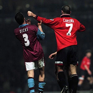 Erica Cantona of Manchester United pushes away West Hams Julian Dicks during the match