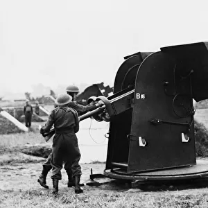 First pictures of the Home Guard A. A in action loading a projector. 8th July 1942