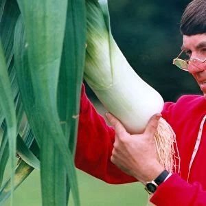 The Leek Show at Beamish Museum and judge Dennis Ash inspect one of the entries in