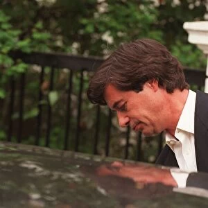 Oliver Hoare the man alleged to have had an affair with Princess Diana leaves for work