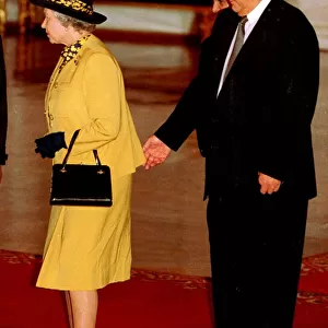 Queen Elizabeth with Boris Yeltsin standing behind at the Kremlin in Moscow