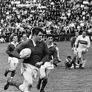 Salford rugby league player Jim Mills in action as he breaks away with the ball during
