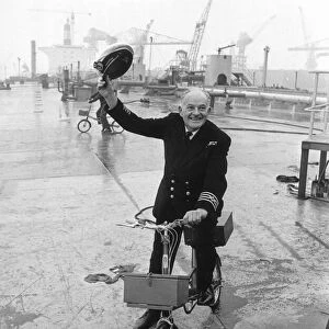 Ships Captain Tom Agnew Captain Agnew with his bike on the deck of the massive Esso