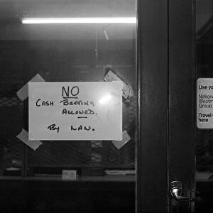 A sign on the door forbidding cash bets at a Sidney Glanz betting shop in the Isle of Man