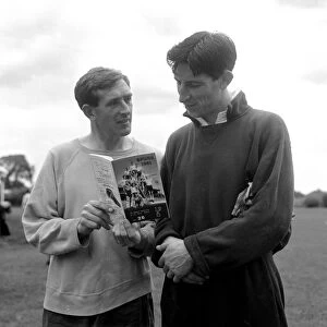 Tottenham Hotspur players Danny Blanchflower and goalkeeper Bill Brown holding a copy of