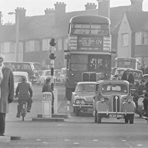 Traffic in High Street Dagenham as the Ford factory turns out at the end of the day shift