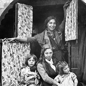 A typical gypsy family at the door of their caravan at the 700 year old fair at Yarm