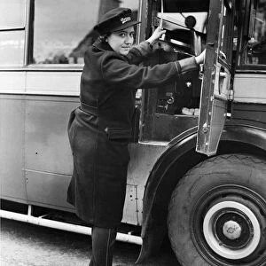 Veteran driver of the Oxford Bus Company Miss Rosalind Williams getting into her cab for
