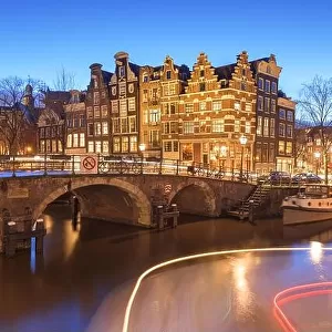 Amsterdam, Netherlands bridges and canals at twilight