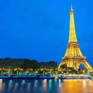Beautiful view of illuminated Eiffel tower at dusk, Paris, France