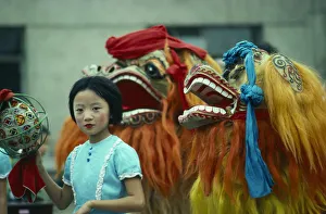 China, General, Chinese New Year Dragon dancers and young girl China, General, Chinese New Year Dragon dancers and young girl